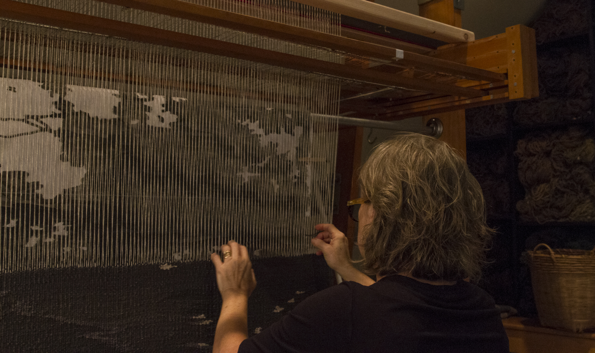 Lyn Sterling Montagne working on a linen tapestry on a vertical tapestry loom in her Atlanta studio, fall 2016
